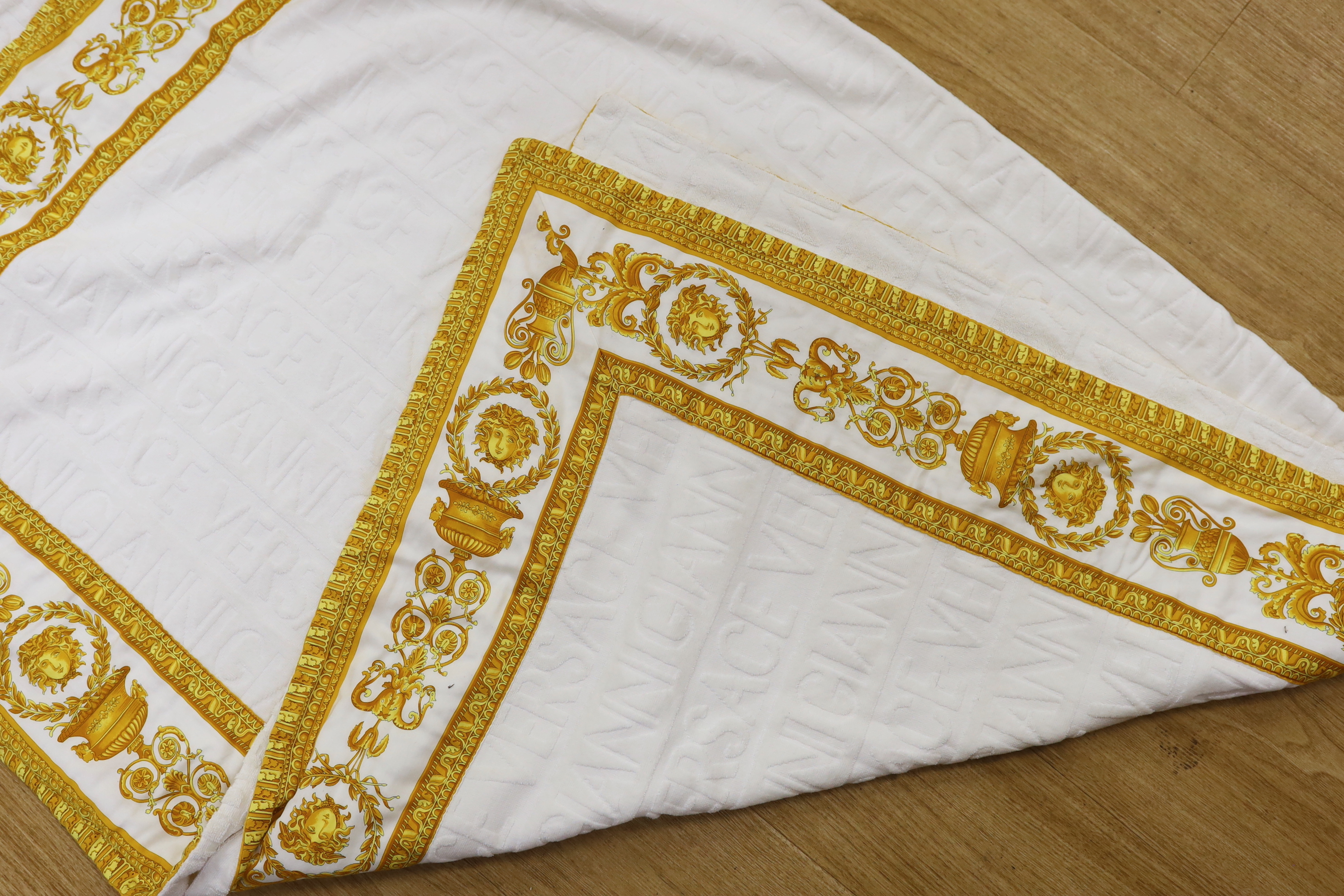 A Gianni Versace cotton throw, with printed border, 192 x 147cm